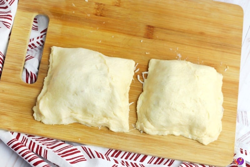 fold into a square and pinch sides together to seal