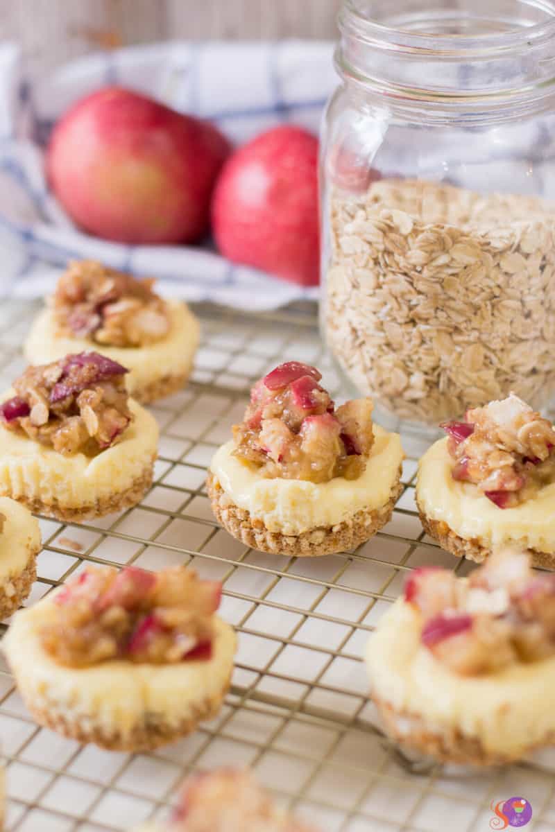 Mini Apple Crumble Cheesecakes on a rack