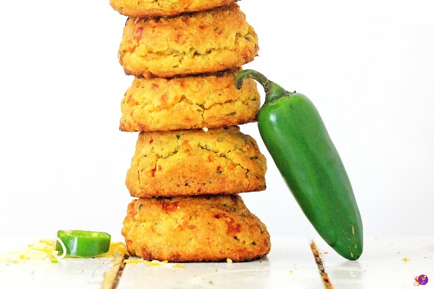 Jalapeño Cheddar Biscuits stacked on plate