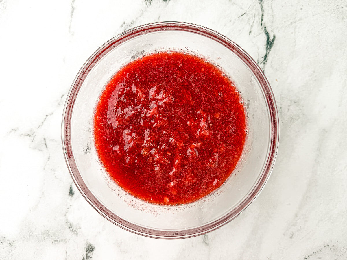 Strawberry filling in glass bowl.