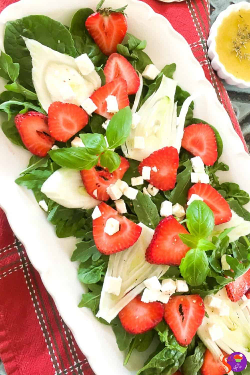 A delightful mixture of fresh baby spinach, arugula, juicy strawberries, crisp fennel, and feta cheese, this salad has a great balance of savory and sweet, crunchy and creamy soft. And, once it's topped off with my savory homemade balsamic dressing, it's packed full of flavor.
