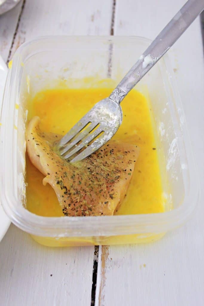 Air Fryer Chicken Parmesan chicken in egg wash