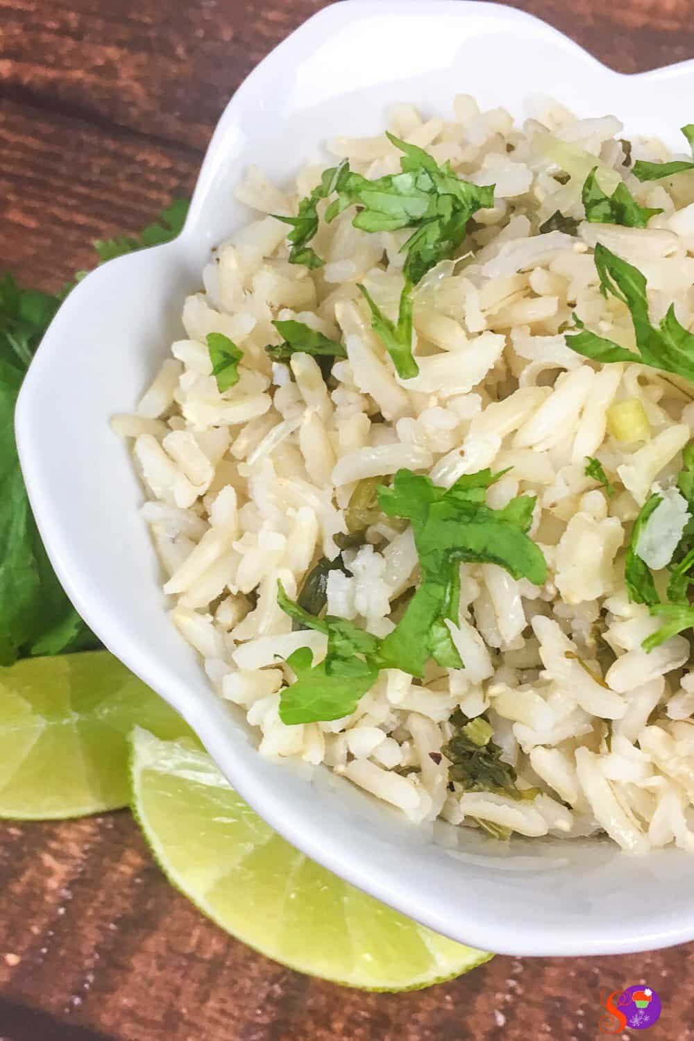 Brown rice is flavored with fresh lime juice, lime zest, garlic, and cilantro in this easy Instant Pot Cilantro Lime Rice recipe!
