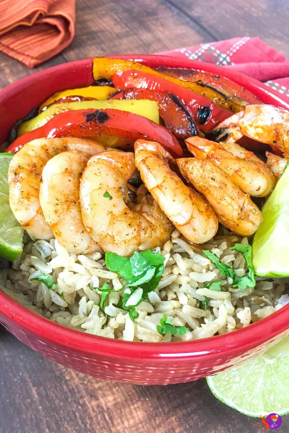 Full of perfectly-seasoned tender shrimp and fresh vegetables and served over a bed of cilantro-lime rice, this Shrimp Fajita Bowls with Cilantro-Lime Rice is sure to become a favorite