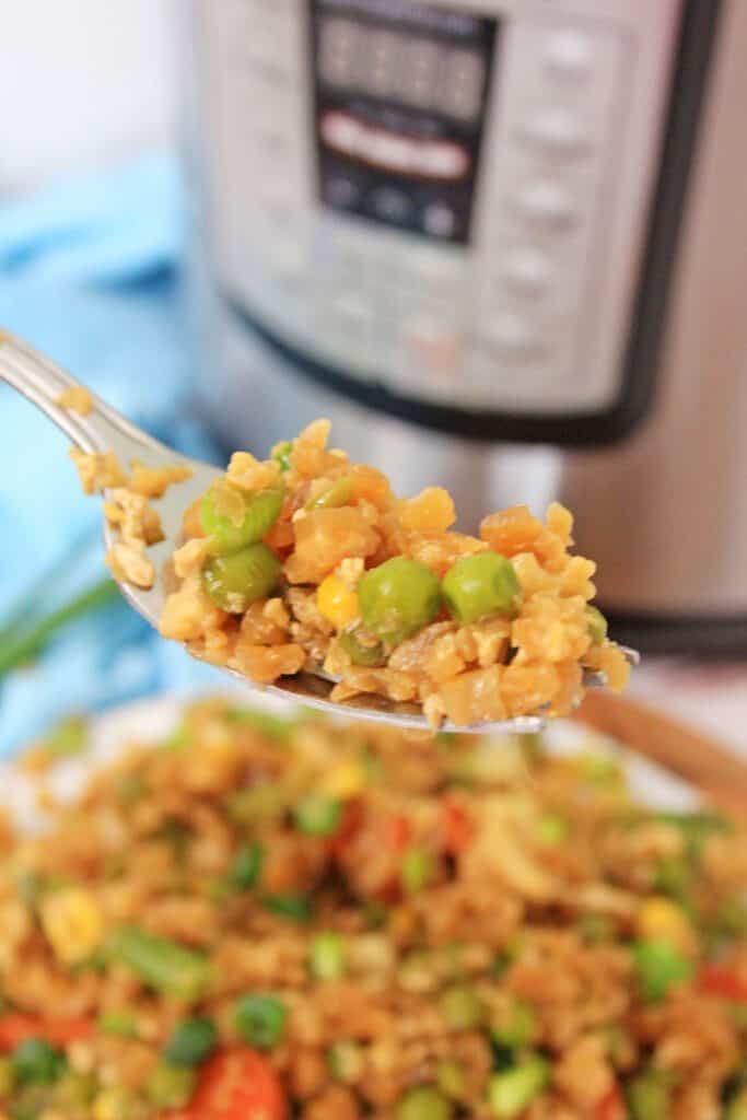 instant pot cauliflower fried rice instant pot cauliflower fried rice on a fork