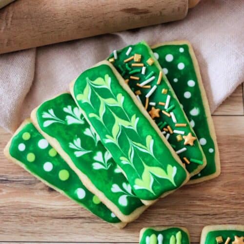 green sugar cookies on wood table