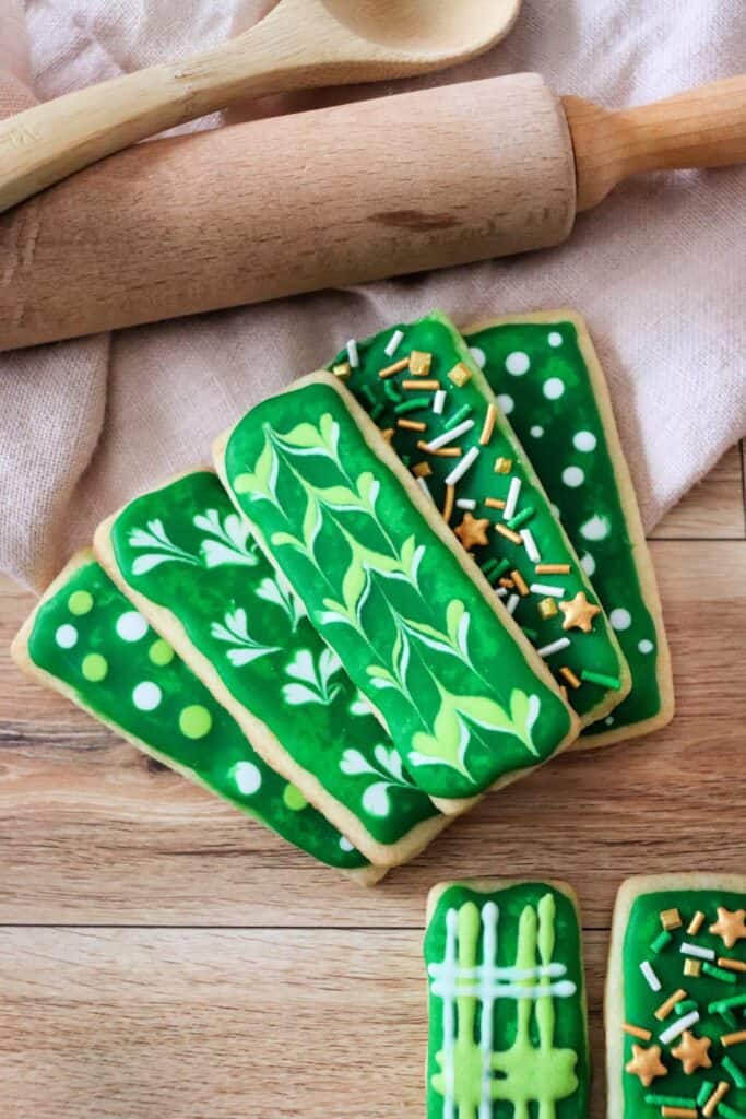 green sugar cookies on wood table
