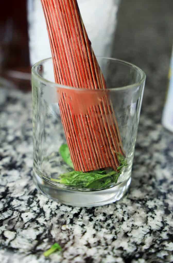 Celebrate Tradition with a Refreshing Mint Julep Recipe 3 Muddle Mint