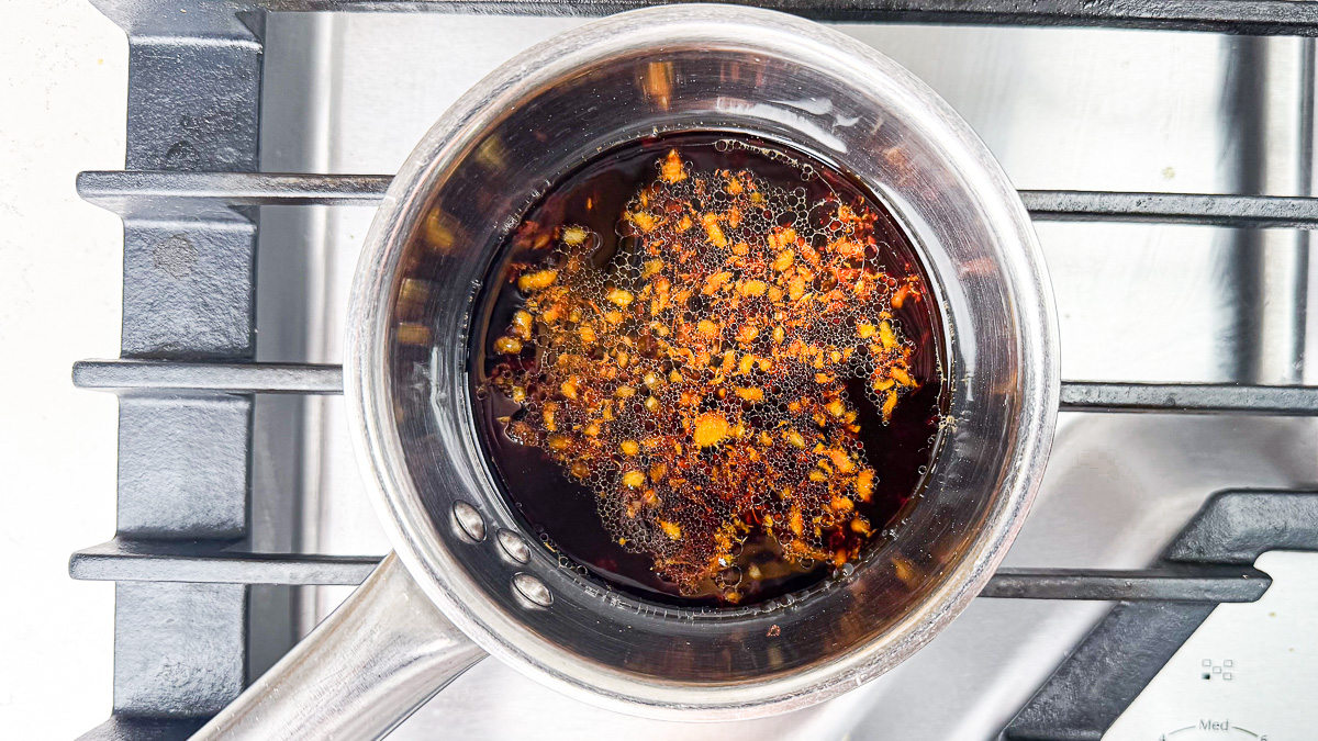 Teriyaki sauce in saucepan boiling on stovetop