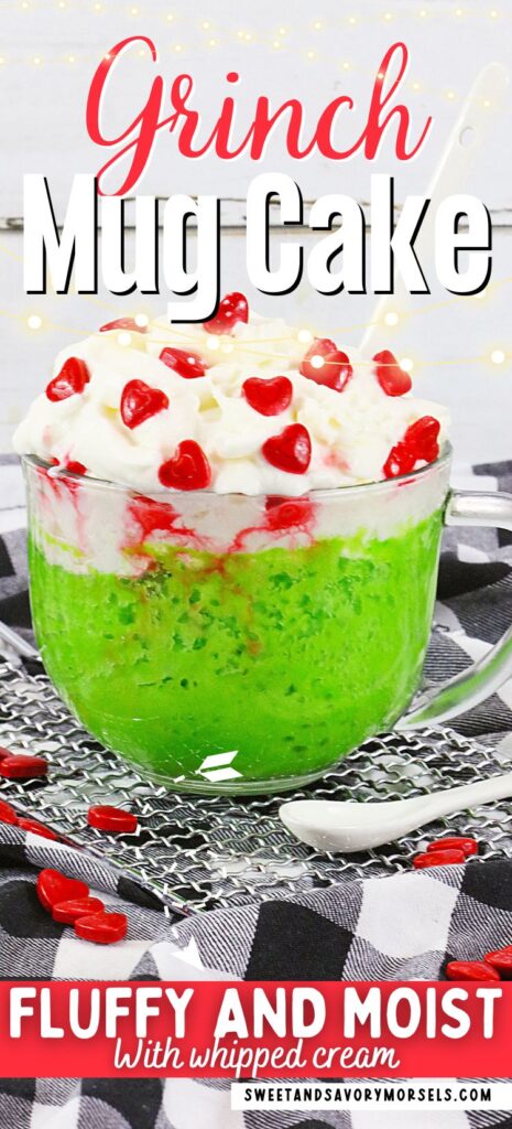 A vibrant green mug cake crowned with whipped cream and red heart-shaped candies perfectly embodies the "Grinch Mug Cake." This fluffy and moist treat is an easy mug cake recipe, ideal for those who love a quick, delightful dessert.