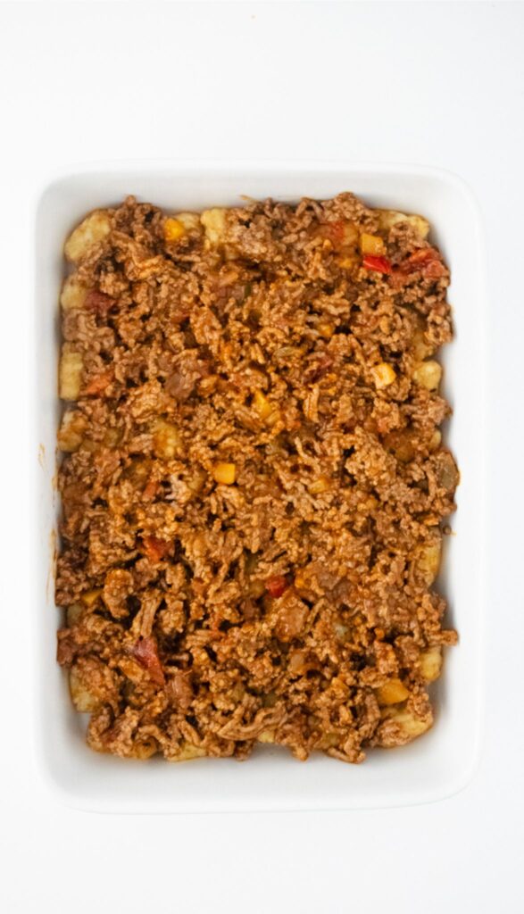 A rectangular white dish topped with the meat mixture.
