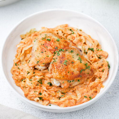 Creamy Cabbage Alfredo with Crispy Chicken Thighs (A Low-Carb Comfort Dinner) 13 Creamy Cabbage Alfredo in a dish on table
