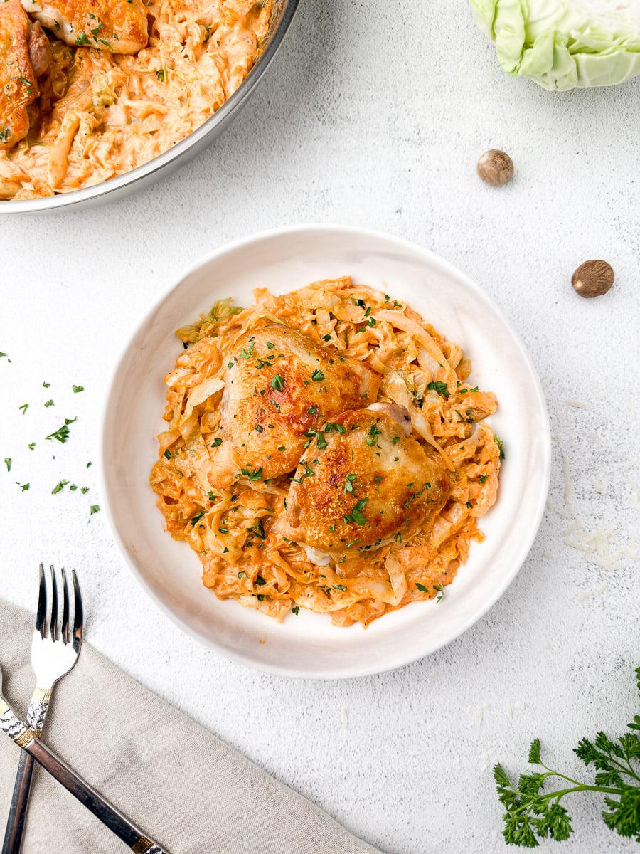 creamy cabbage alfredo recipe plate with on table with fork.