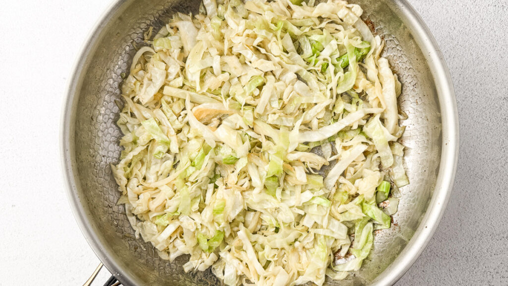 Creamy Cabbage Alfredo with Crispy Chicken Thighs (A Low-Carb Comfort Dinner) 7 Sautéed cabbage in pan
