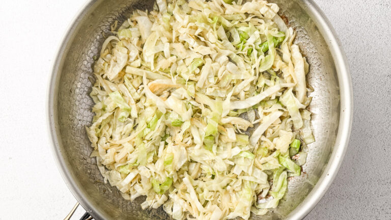 Creamy Cabbage Alfredo with Crispy Chicken Thighs (A Low-Carb Comfort Dinner) 16 Sautéed cabbage in pan
