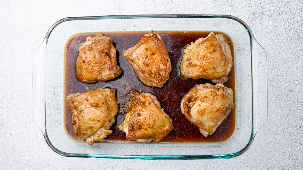 chicken thighs in marinade sauce in oven safe pan