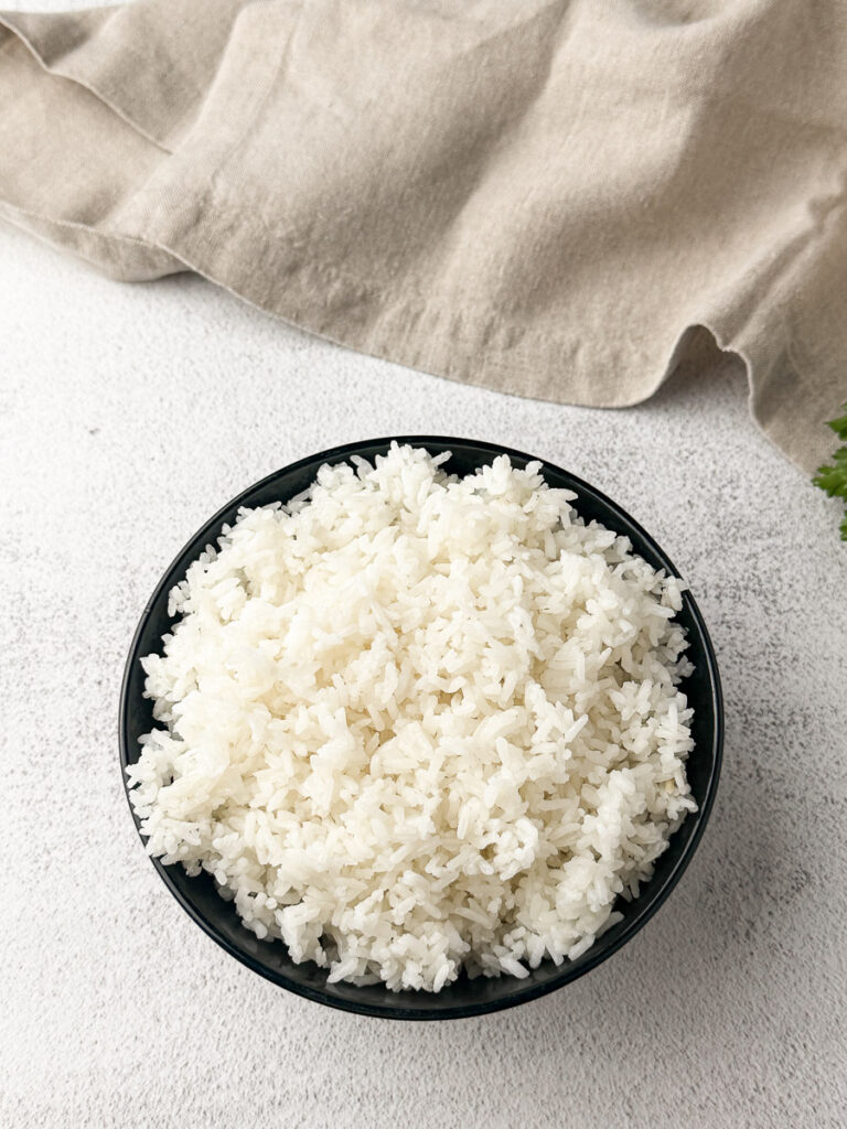 bowl with white rice on table