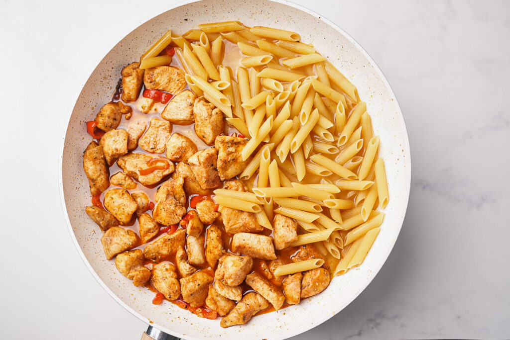 One-Pot Cajun Chicken Pasta (Easy 30-Minute Dinner) 7 Seared chicken breast with mini peppers, penne pasta and chicken broth.