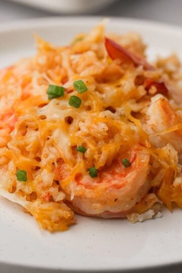 Shrimp and rice casserole on white plate.