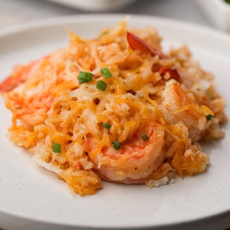 Shrimp and rice casserole on white plate.