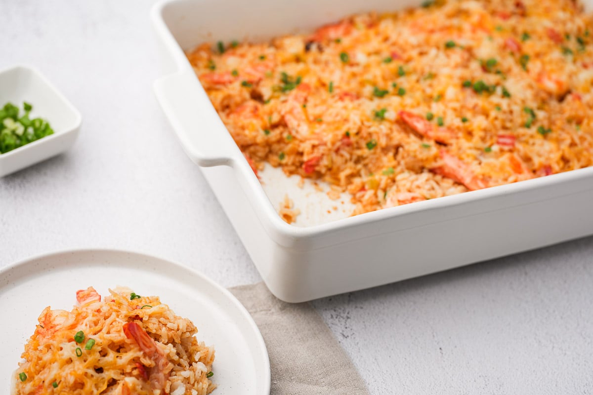 plate and baking pan with shrimp and rice and vegetables