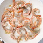 Seared shrimp with garlic and butter in a large skillet