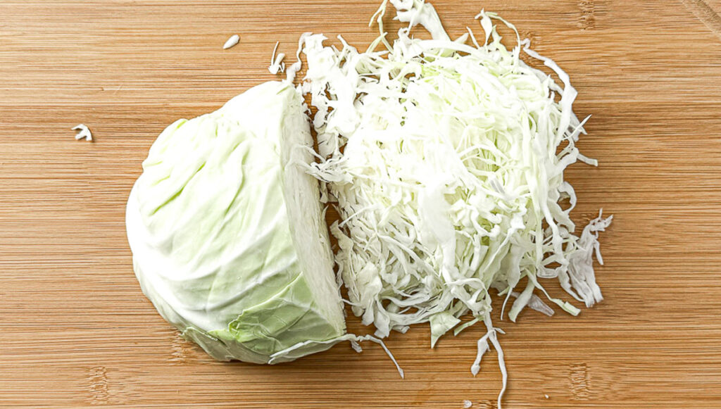 5 simple cabbage recipes - cabbage shredded on cutting board