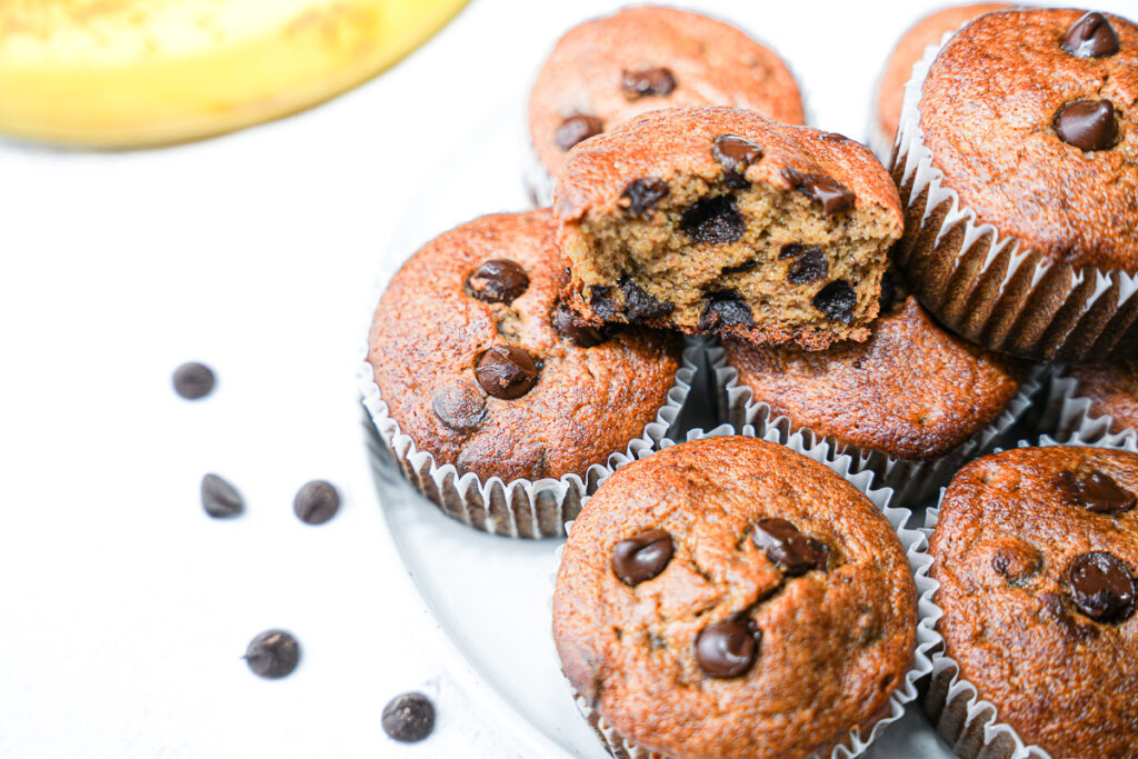Healthy Almond Butter Banana Chocolate Chip Muffins broken out to show texture