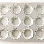 Healthy Almond Butter Banana Chocolate Chip Muffins pan lined with muffin liners