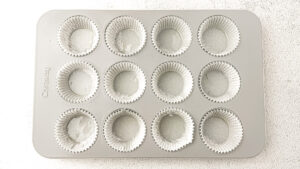 Healthy Almond Butter Banana Chocolate Chip Muffins pan lined with muffin liners