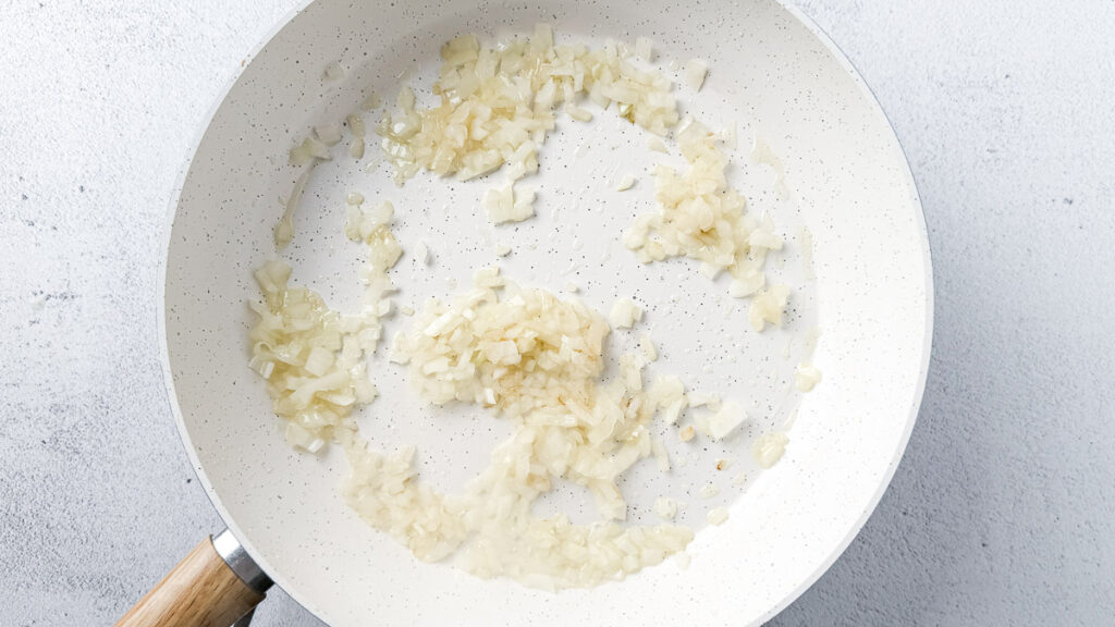 creamy cabbage and kielbasa skillet ingredients - chopped onion