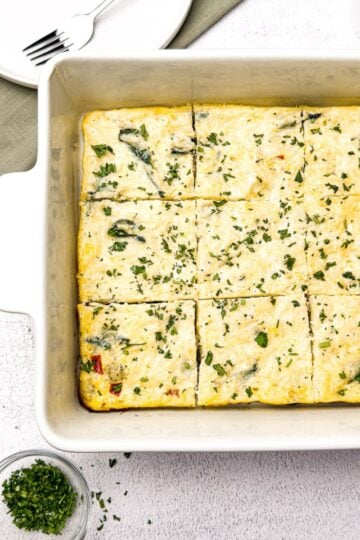 Sausage and egg breakfast casserole in pan on table.