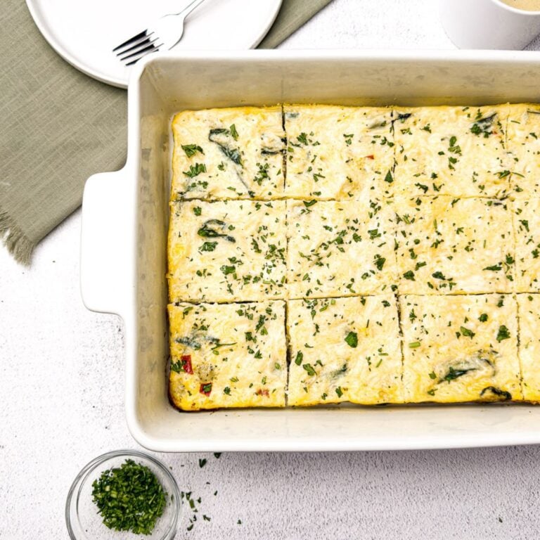 Sausage and egg breakfast casserole in pan on table.