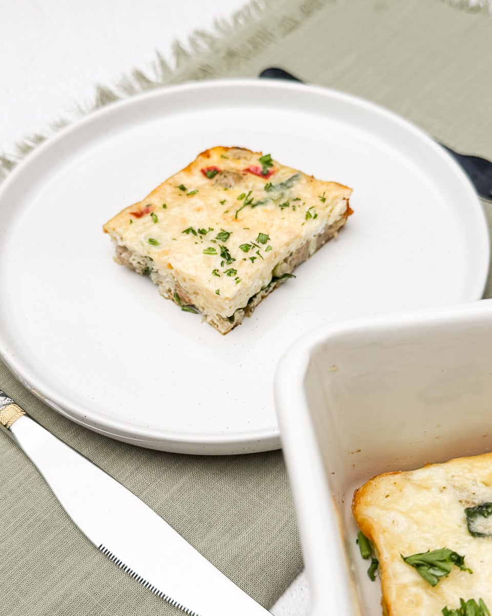 sausage and egg casserole in a plate and pan.