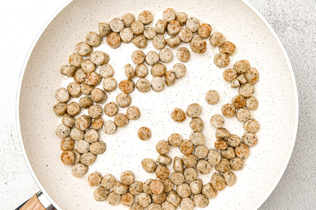 Easy Sausage and Egg Breakfast Casserole (No Bread!) 5 chicken sausage seared in white pan