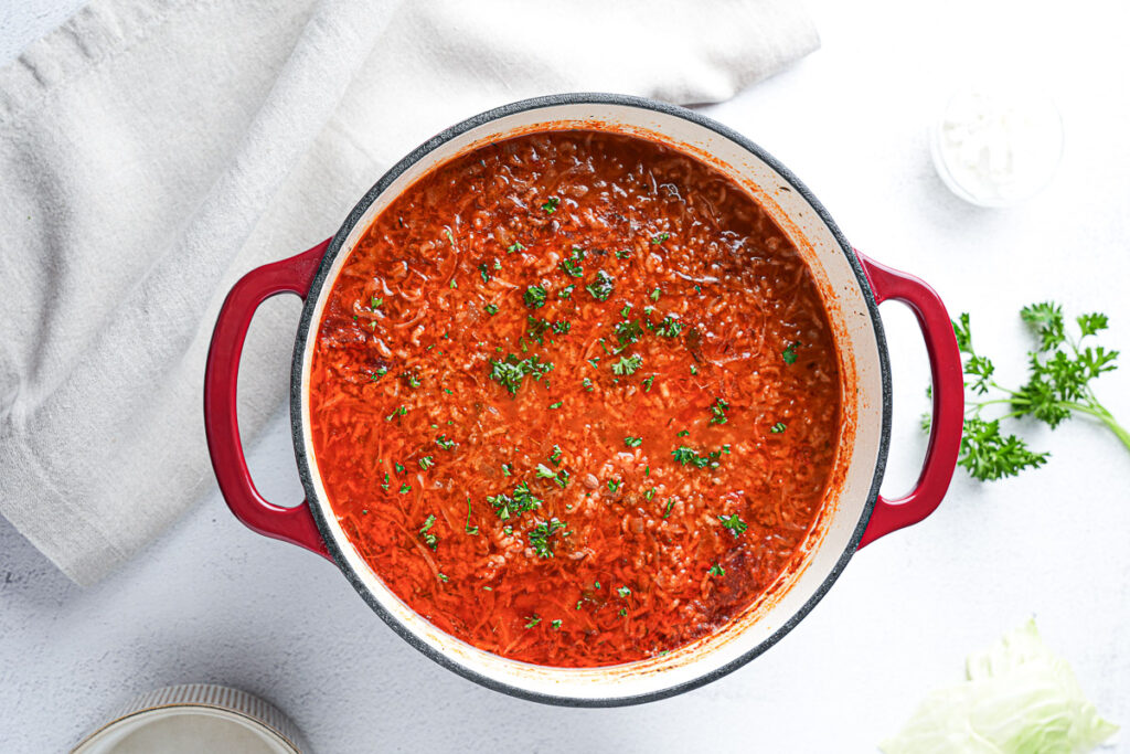 Easy Stuffed Cabbage Soup (1-Pot Deconstructed Golumpki) 13 Deconstructed stuffed cabbage soup with ground beef, cabbage, and rice in a Dutch oven