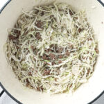 Deconstructed stuffed cabbage soup with ground beef, cabbage, and rice in a Dutch oven