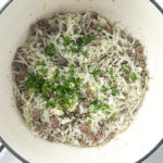 Deconstructed stuffed cabbage soup with ground beef, cabbage, and rice in a Dutch oven