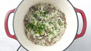 Deconstructed stuffed cabbage soup with ground beef, cabbage, and rice in a Dutch oven