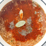 Deconstructed stuffed cabbage soup with ground beef, cabbage, and rice in a Dutch oven