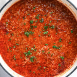 Deconstructed stuffed cabbage soup with ground beef, cabbage, and rice in a Dutch oven