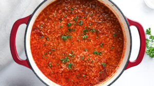 Deconstructed stuffed cabbage soup with ground beef, cabbage, and rice in a Dutch oven