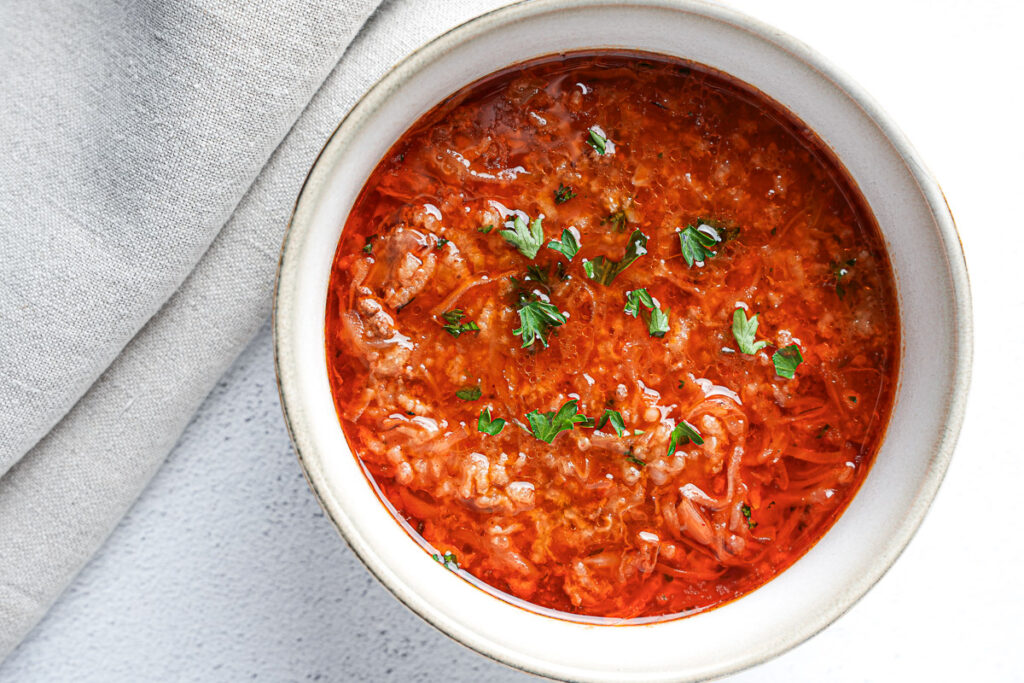 Easy Stuffed Cabbage Soup (1-Pot Deconstructed Golumpki) 2 Deconstructed stuffed cabbage soup with ground beef, cabbage, and rice in a soup bowl