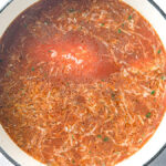 Deconstructed stuffed cabbage soup with ground beef, cabbage, and rice in a Dutch oven