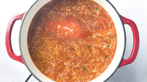 Deconstructed stuffed cabbage soup with ground beef, cabbage, and rice in a Dutch oven