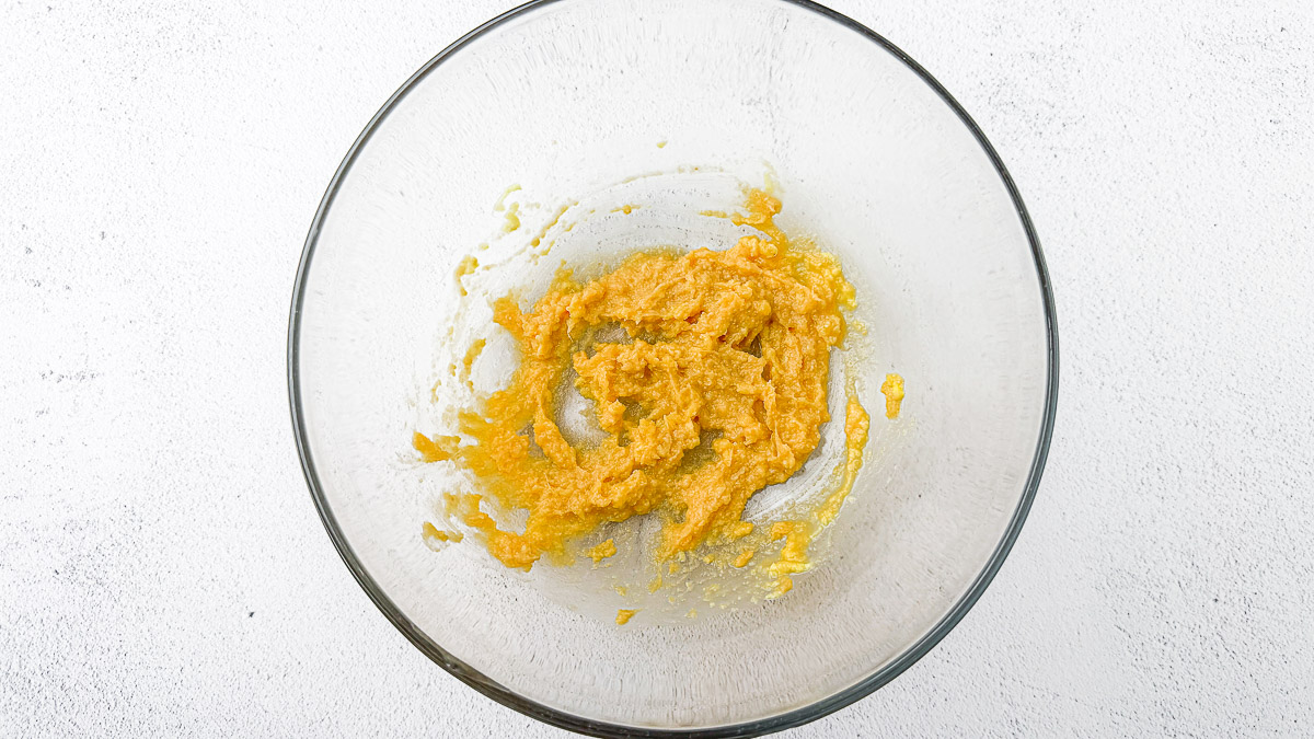 Ginger and miso paste with rice vinegar and maple syrup in a glass bowl