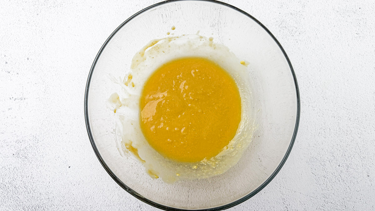 ginger miso with maple syrup, rice vinegar, avocado oil and olive all mixed together in a glass bowl