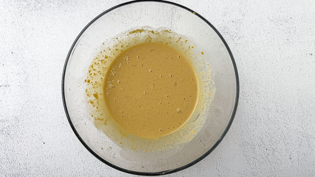 Spicy peanut satay sauce recipe step 2: adding warm water