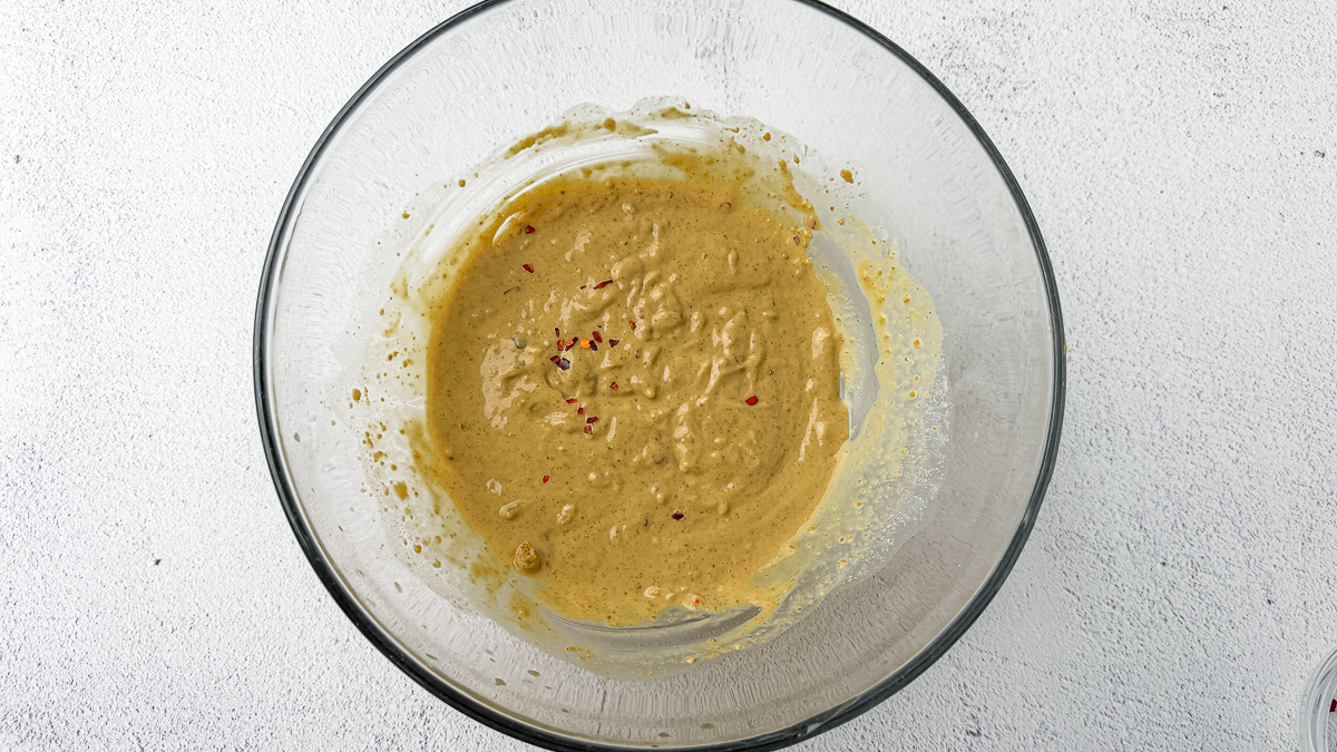 Spicy peanut satay sauce recipe step 2: adding red pepper flakes