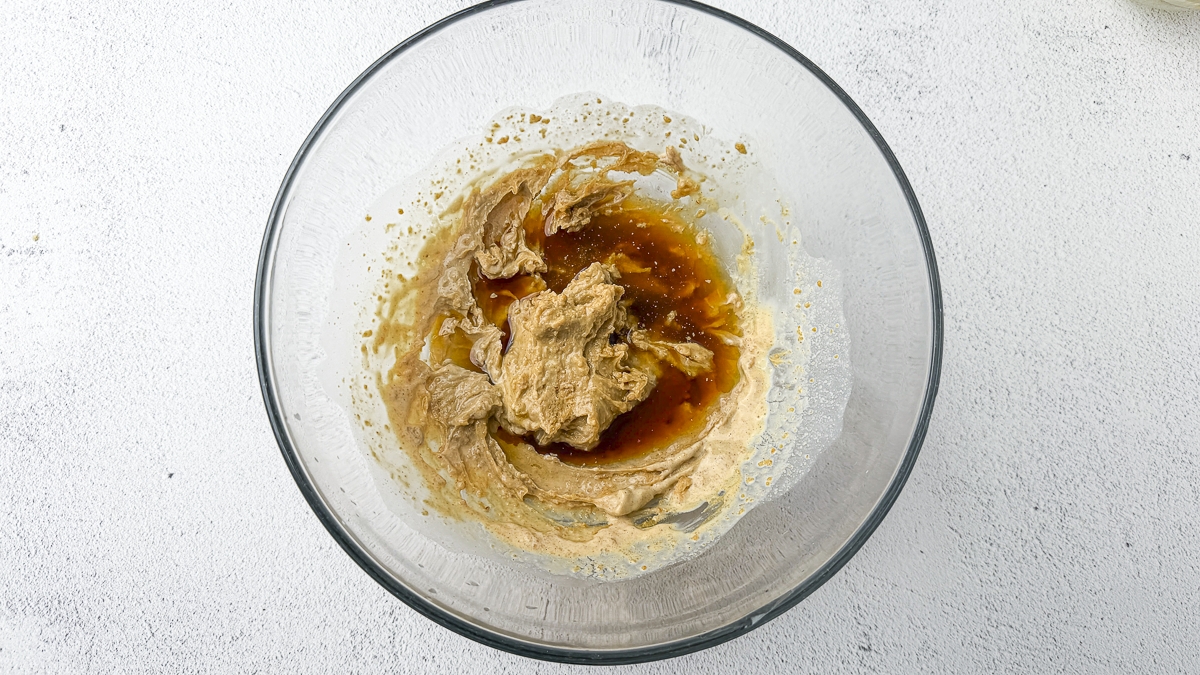 Spicy peanut satay sauce recipe step 2: adding lime juice, coconut aminos and grated ginger